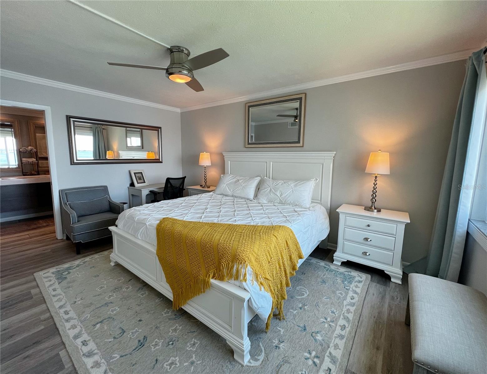 Spacious primary suite with a private attached bathroom and walk in closet.