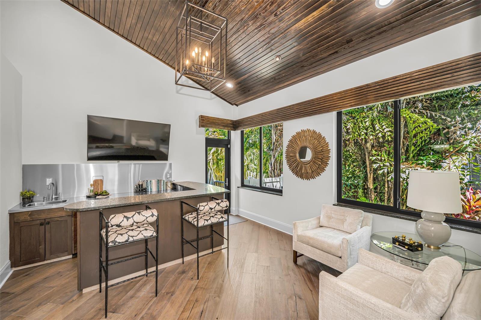 The perfect spot to entertain with light pouring in from windows.