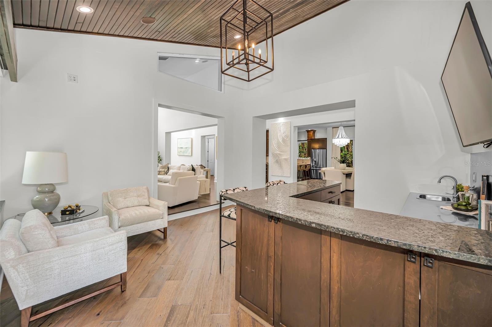 The wet bar is steps away from the Kitchen and Living Room.