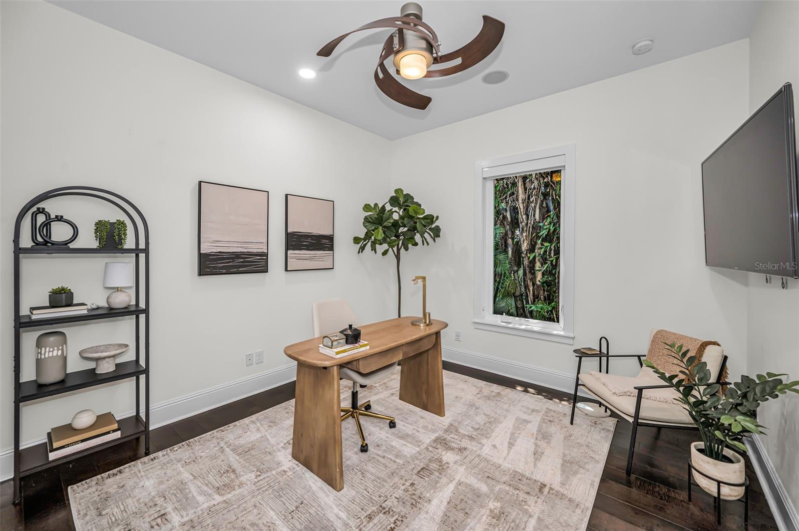 Secondary Ensuite Bedroom on main level offers flexibility as either a guest retreat or perfect office space.