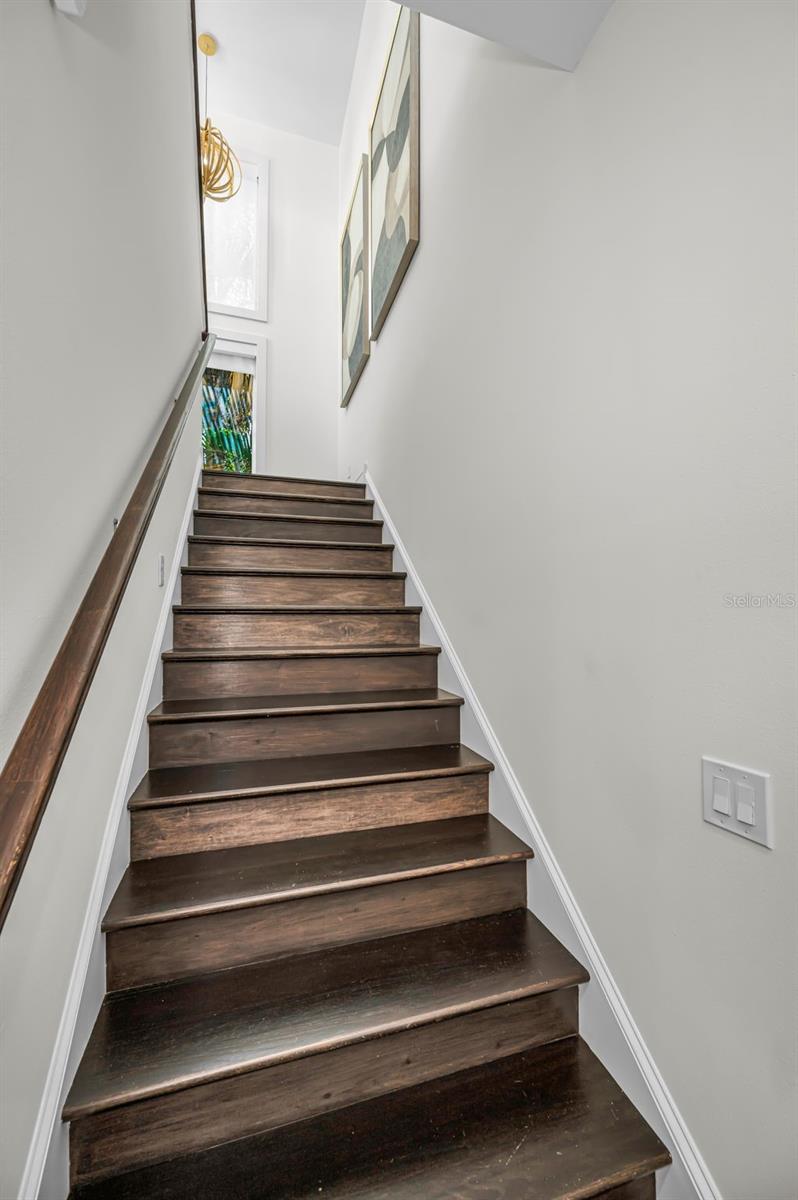 Thoughtfully arranged in a mezzanine-style design overlooking the living space from upstairs.