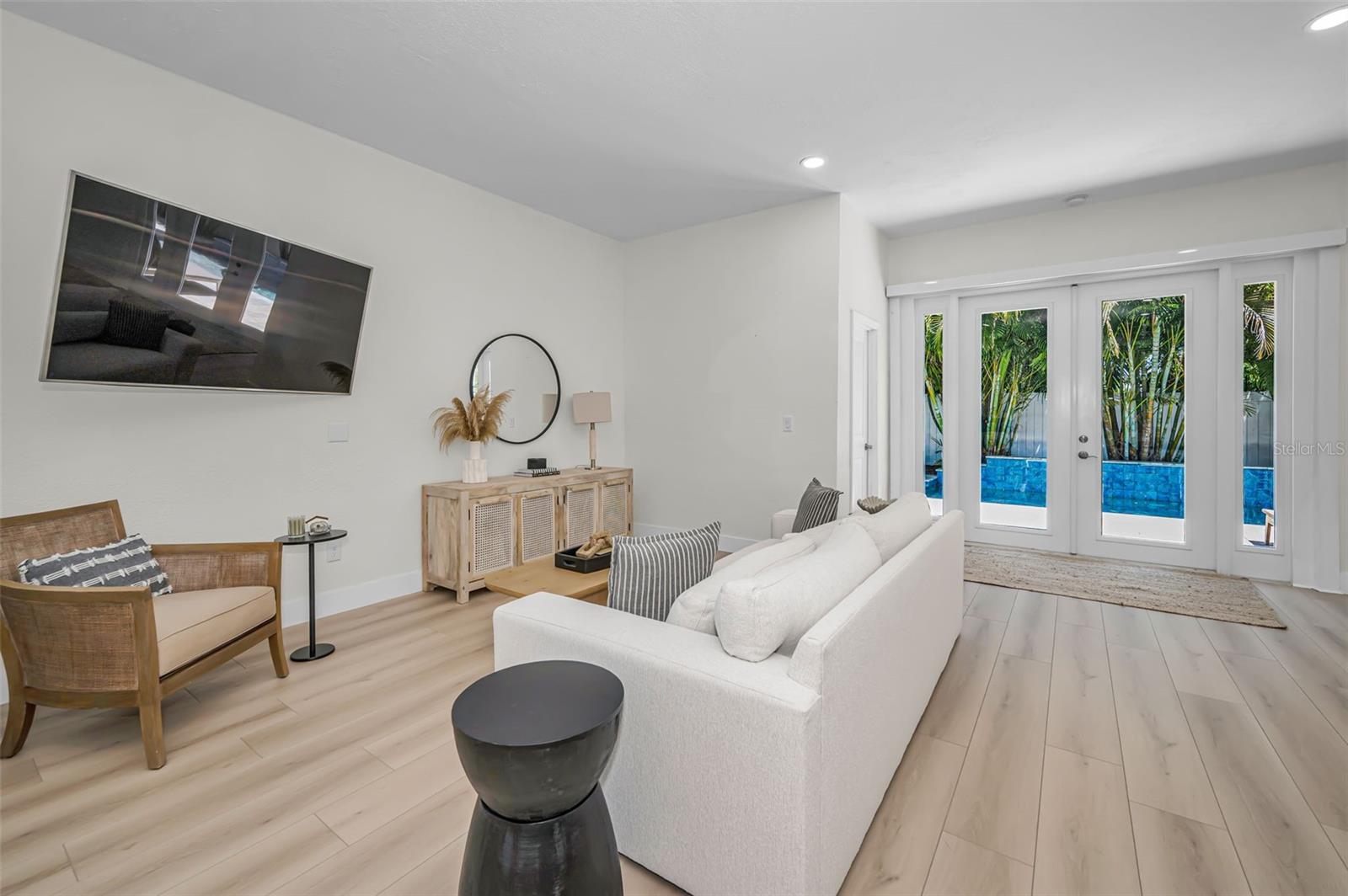 And French doors that open right to the pool area.