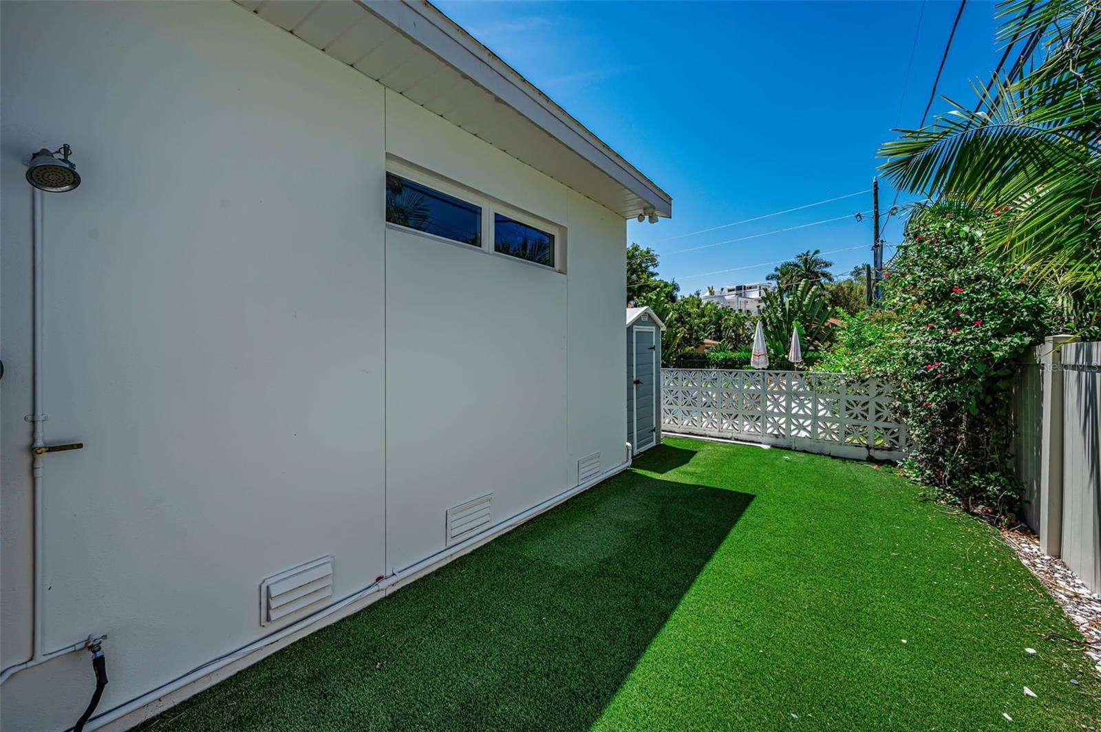 Turf in the back is perfect for pets.