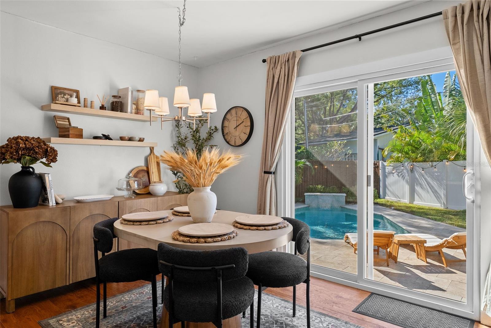 dining area & sliders to pool