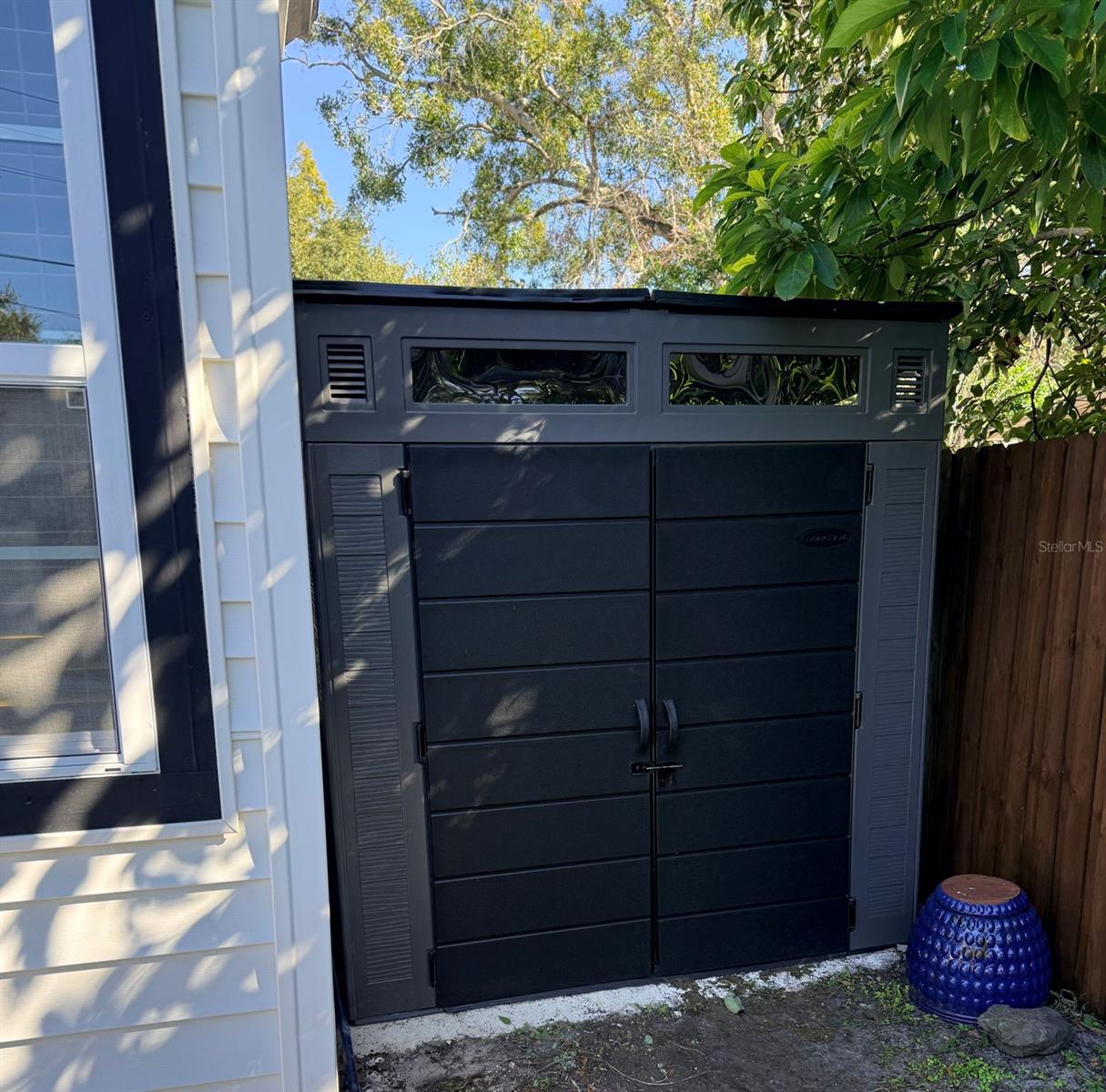 pool shed in hidden corner for storage