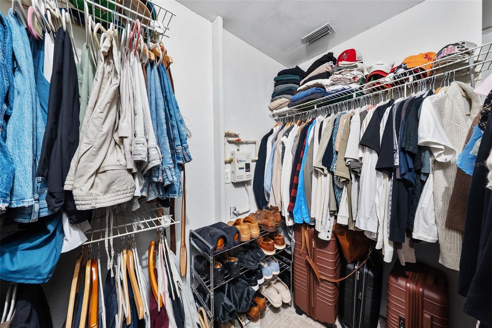 master walk-in closet and tankless hot water heater