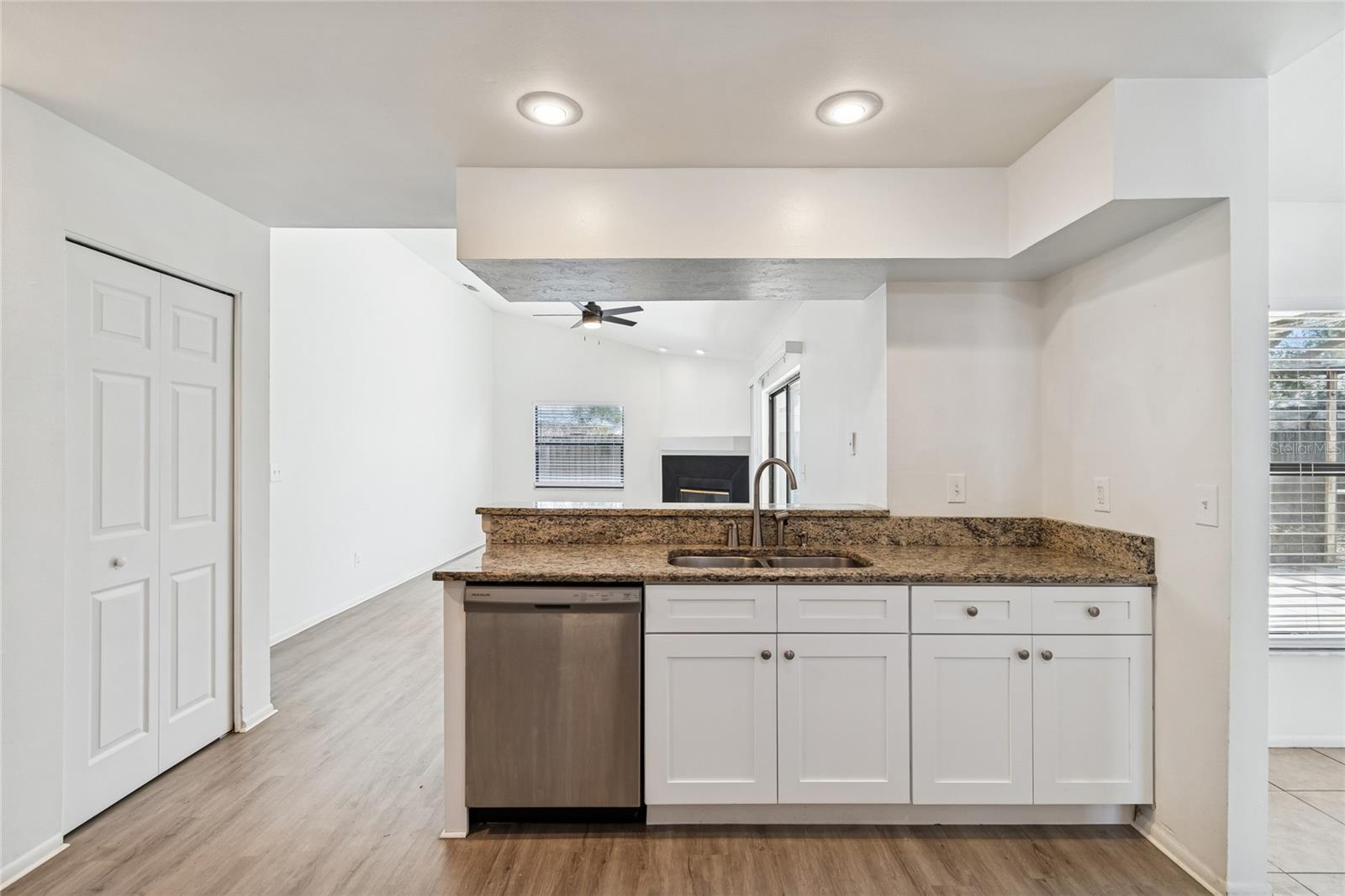 KITCHEN LOOKING OUT INTO THE DEN