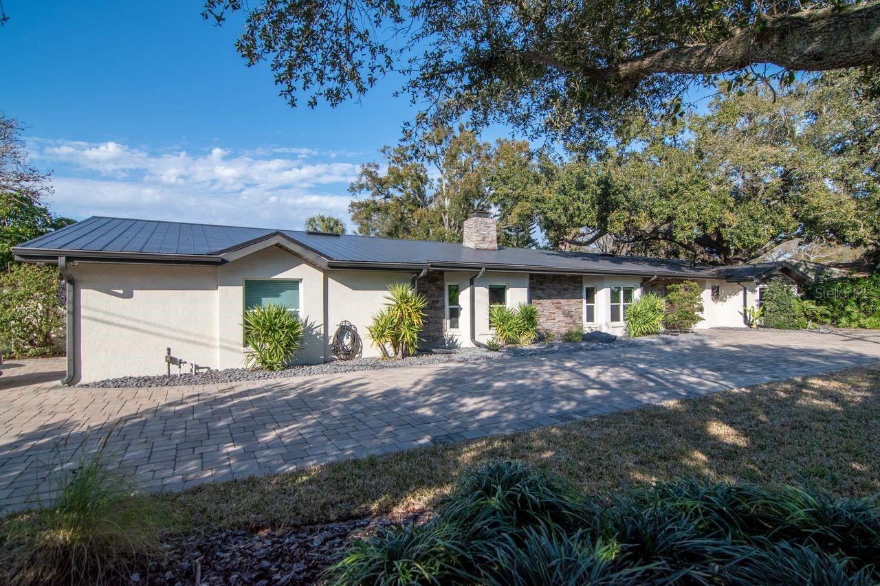 Front of house -Side car garage and circular driveway
