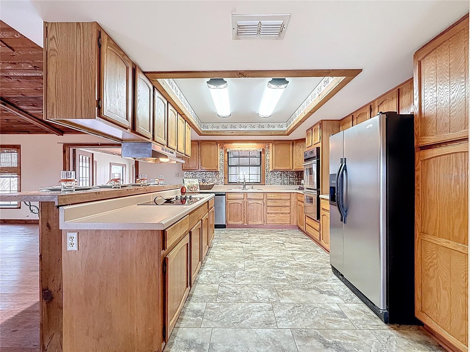 Kit with eat in breakfast bar, loads of counter top and light