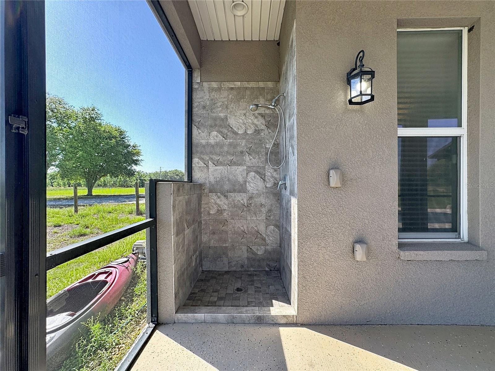 outdoor shower inside screened in room