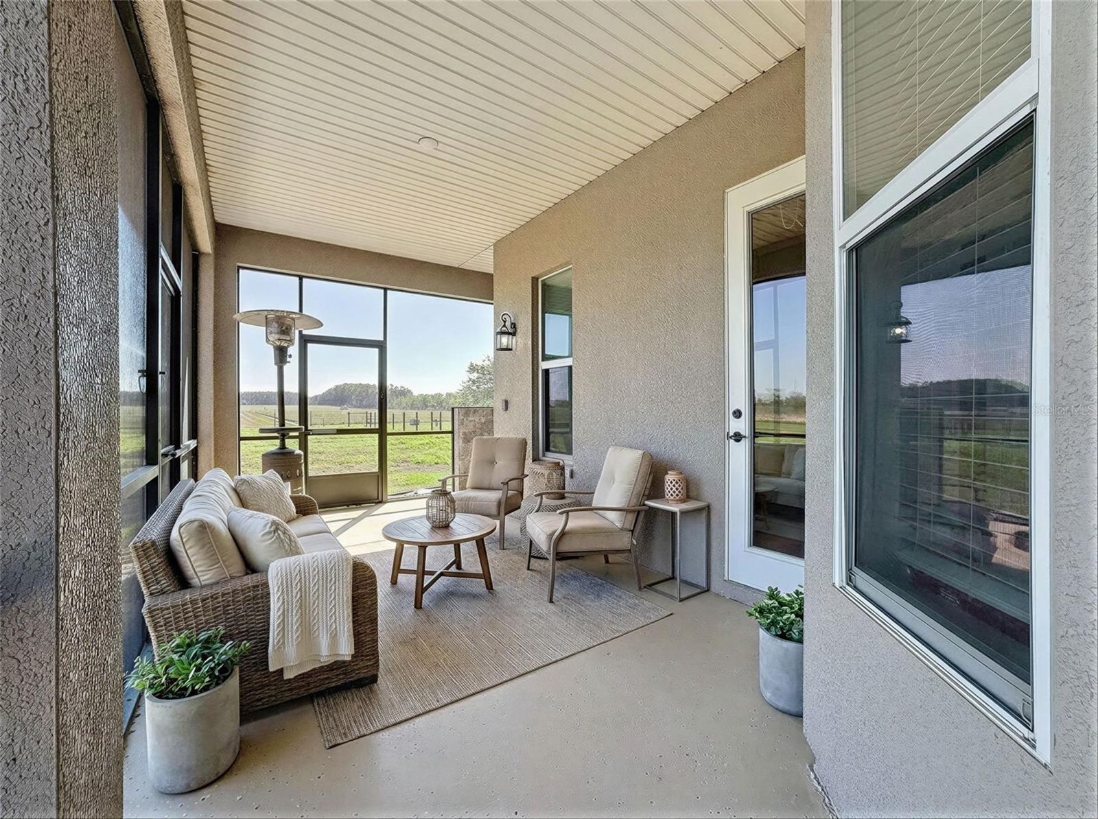 outdoor area with outdoor shower, also has door to half bath/from pool.