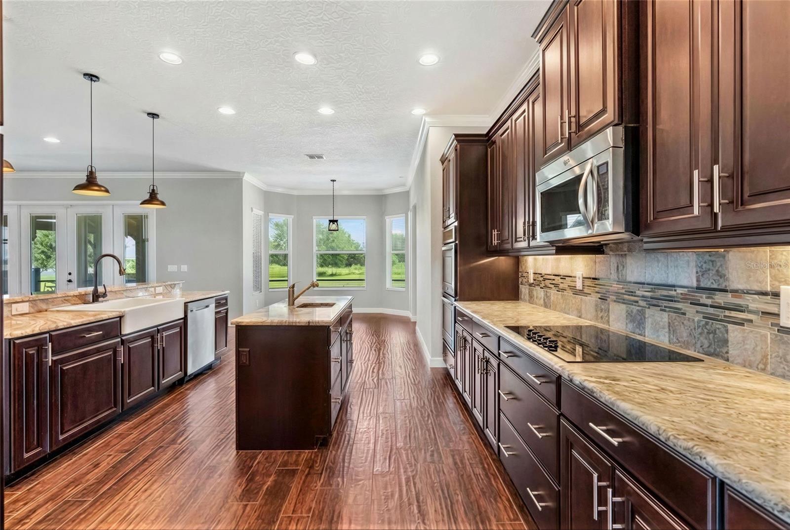 Large modern kit with double ovens, cook top, fridge, island etc