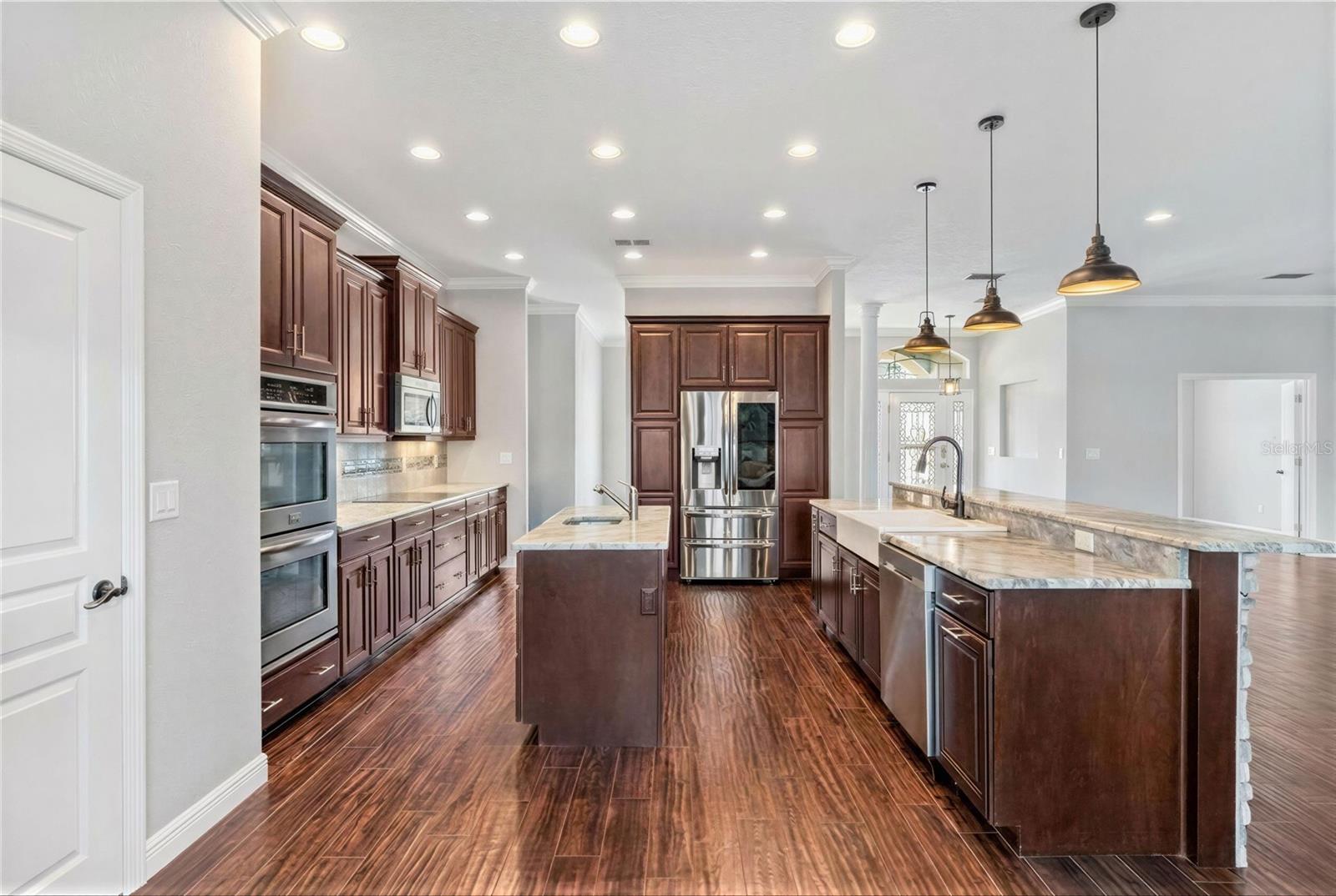 Large modern kit with double ovens, cook top, fridge, island etc