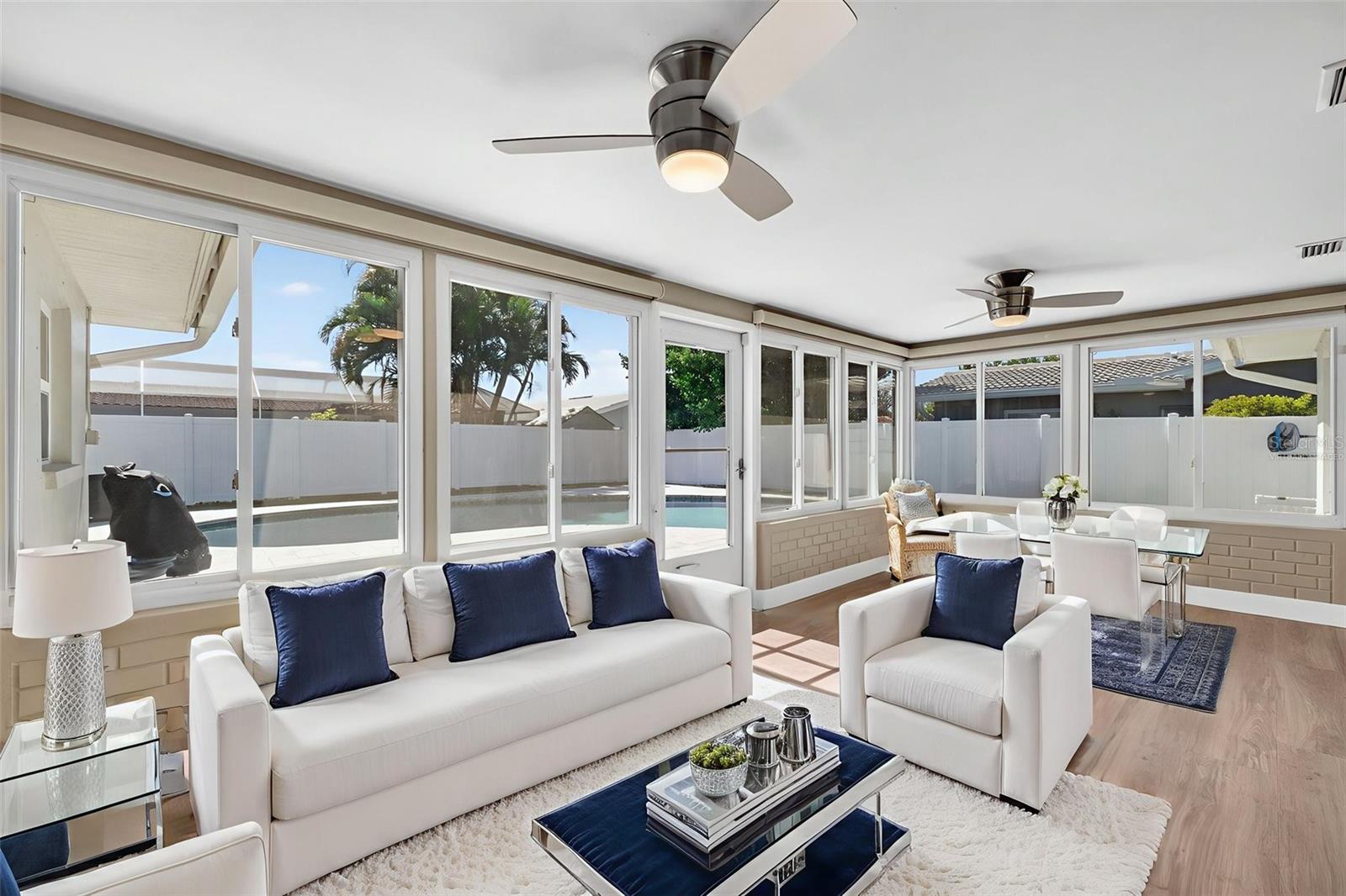 Beautiful space overlooking the beautiful pool before your morning swim. Virtually staged