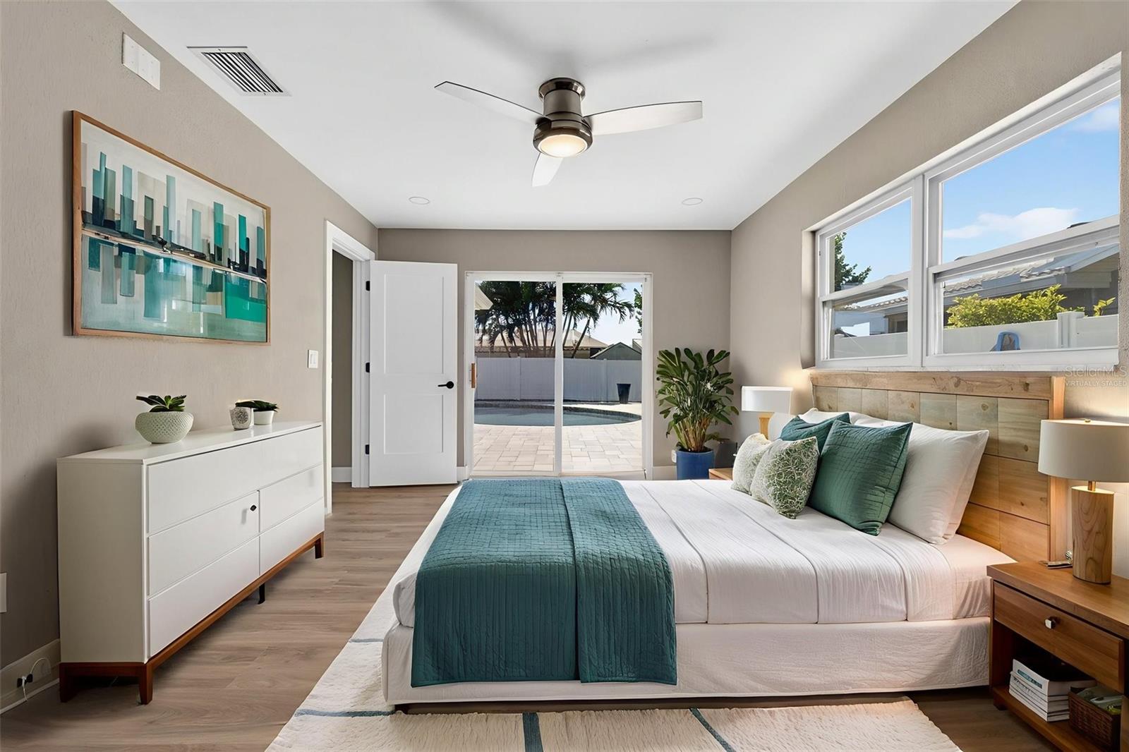 Primary Bedroom retreat with direct access to the pool .  Virtually staged