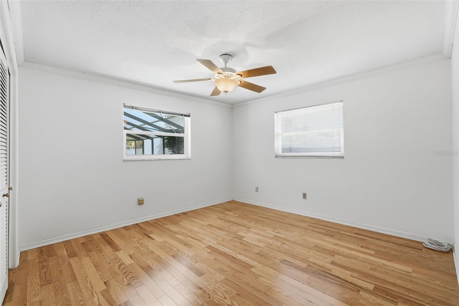 Bedroom 3 with large closet with built-ins overlooking pool