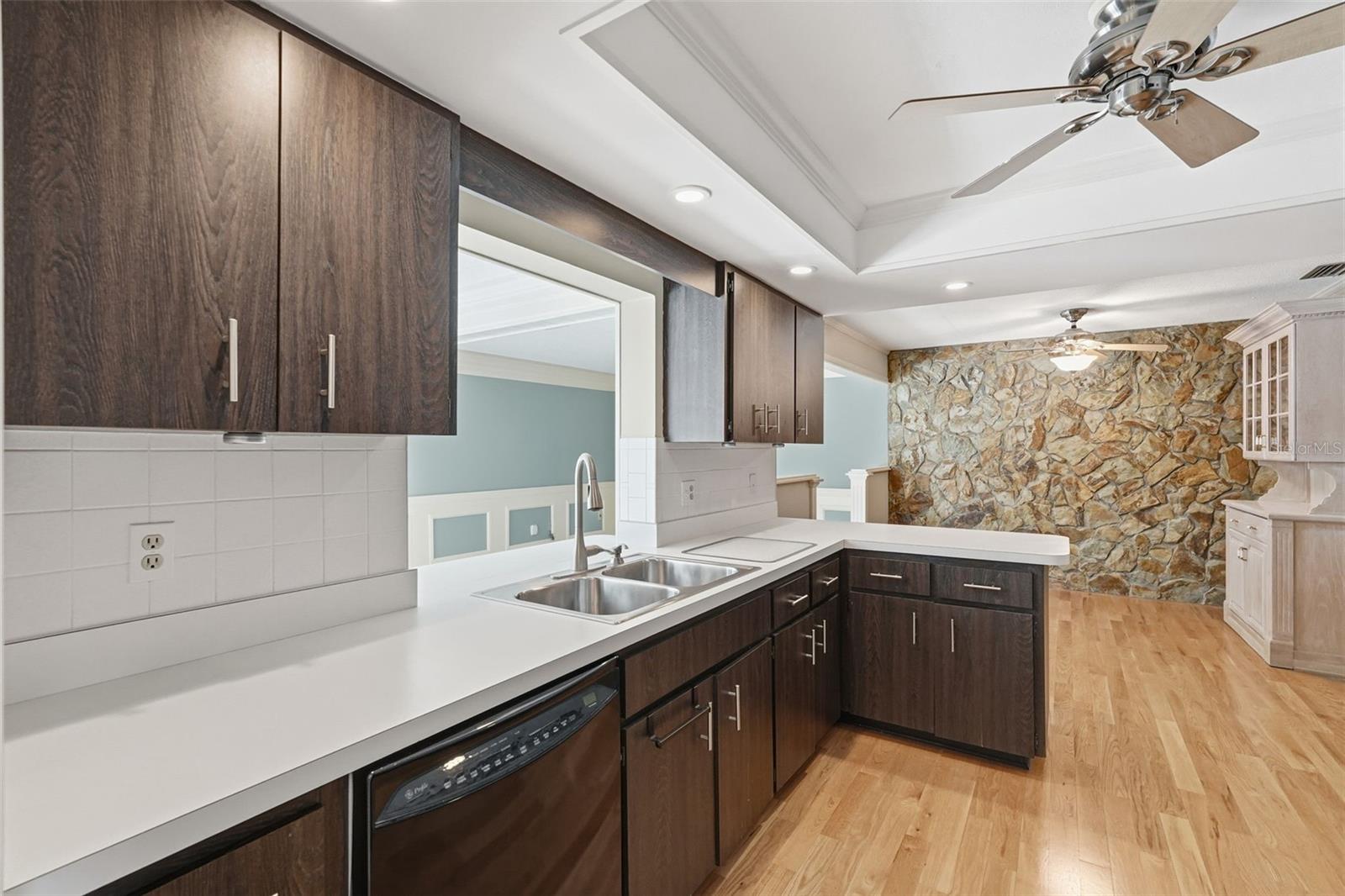 Open Kitchen overlooking Family Room and Lanai/Pool