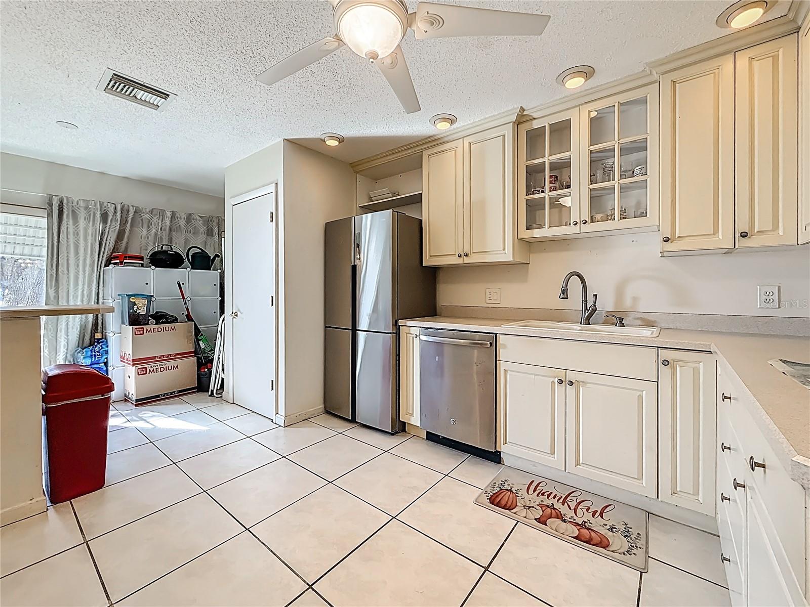 1020 85th Ave N no 119, Kitchen, laundry closet next to refrigerator