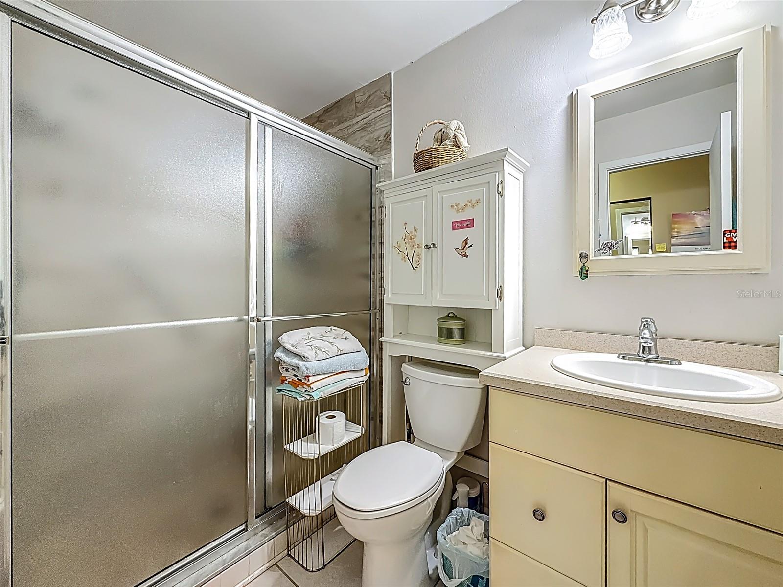 1020 85th Ave N no 119, Primary bedroom ensuite bath, walk in shower