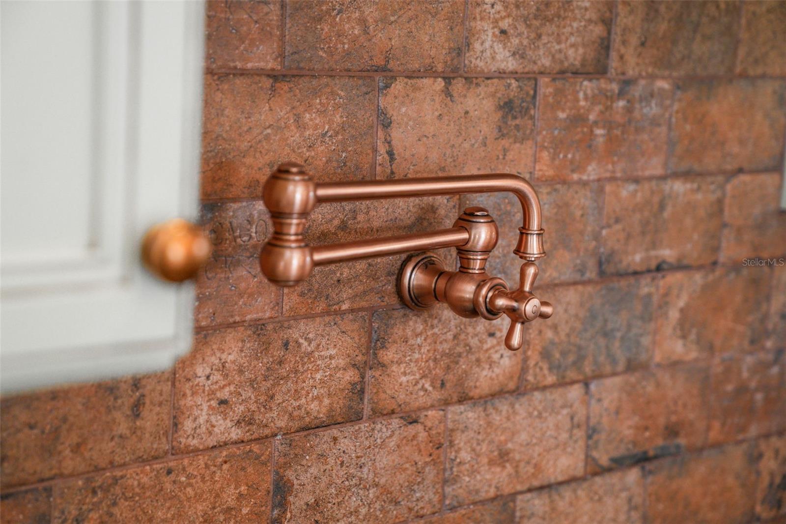 Pot Filler- Brick backsplash