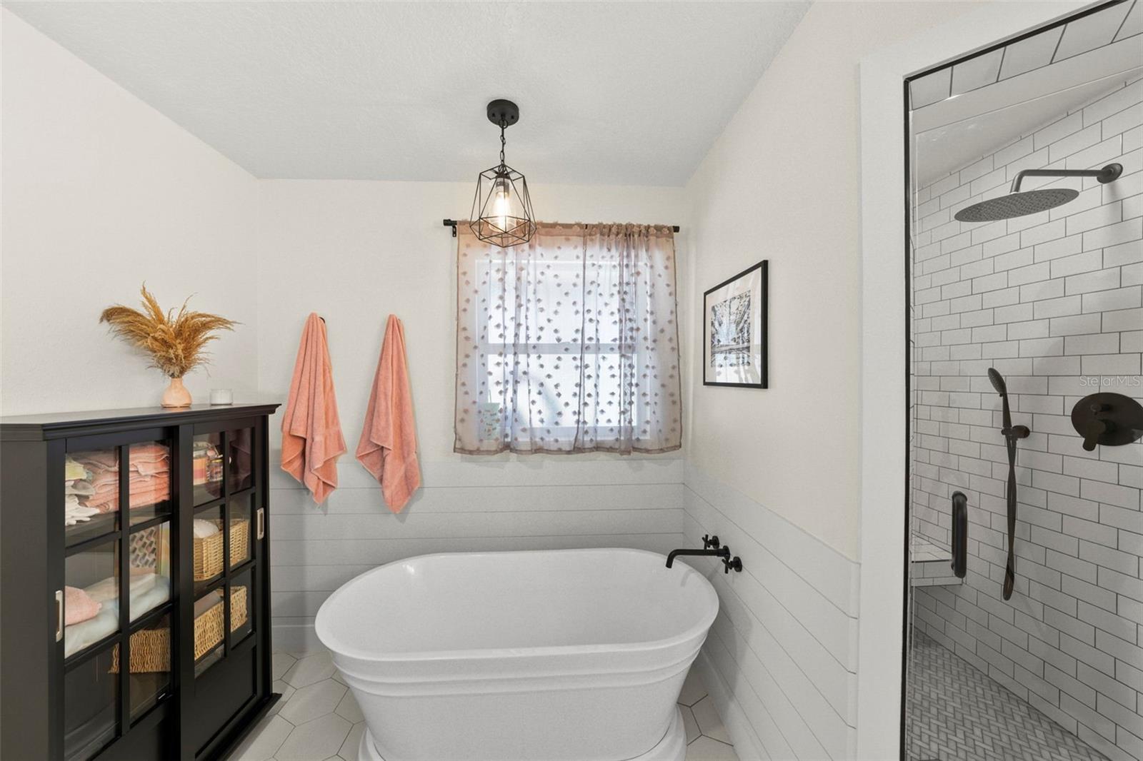 With soaking tub and shower