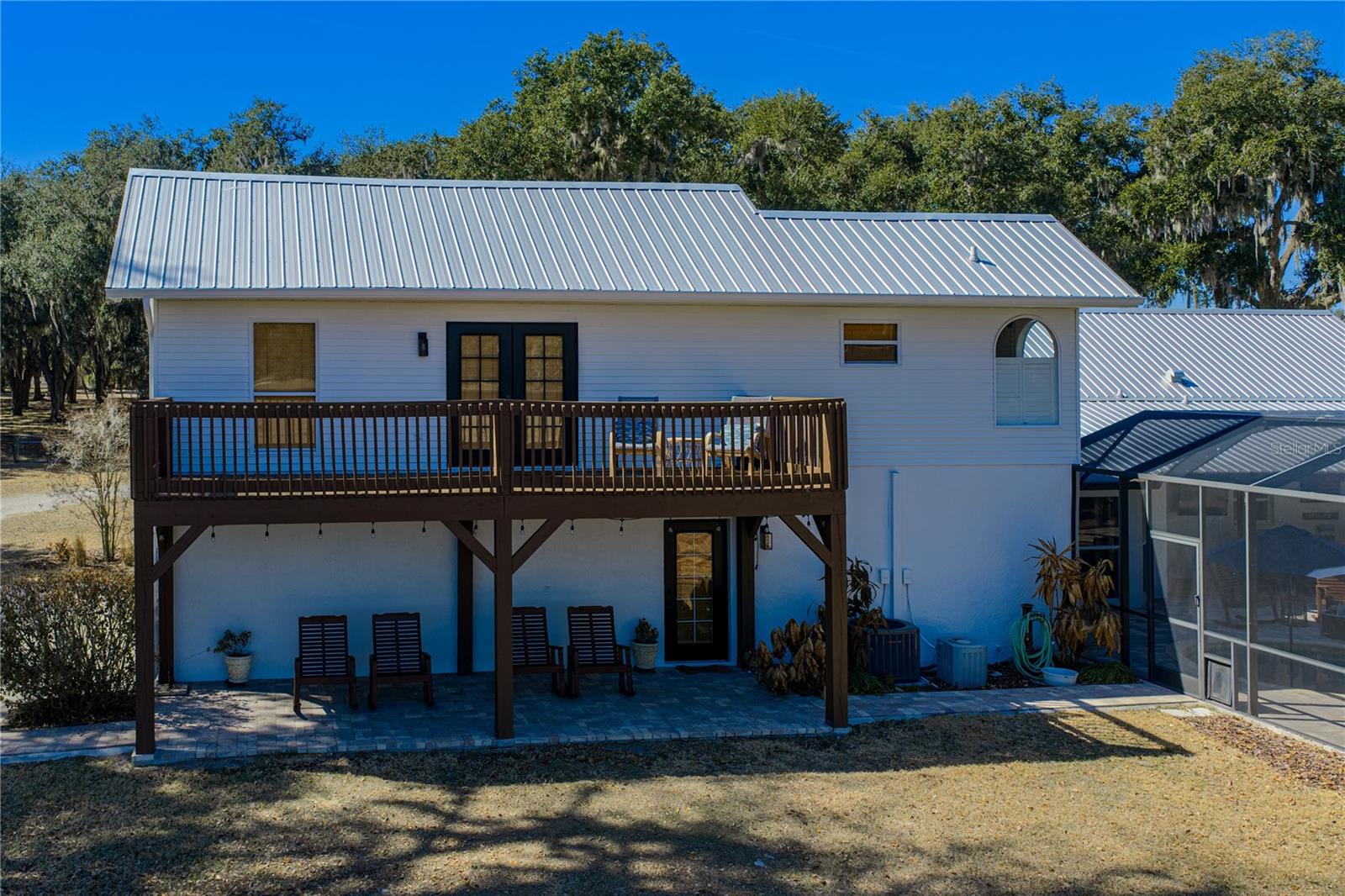 Upstair Primary bedroom balcony, downstairs door to mud room