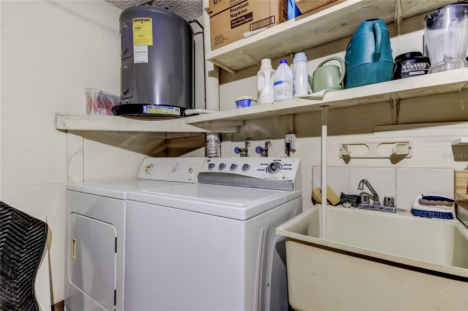 washer and dryer convey, located in garage.