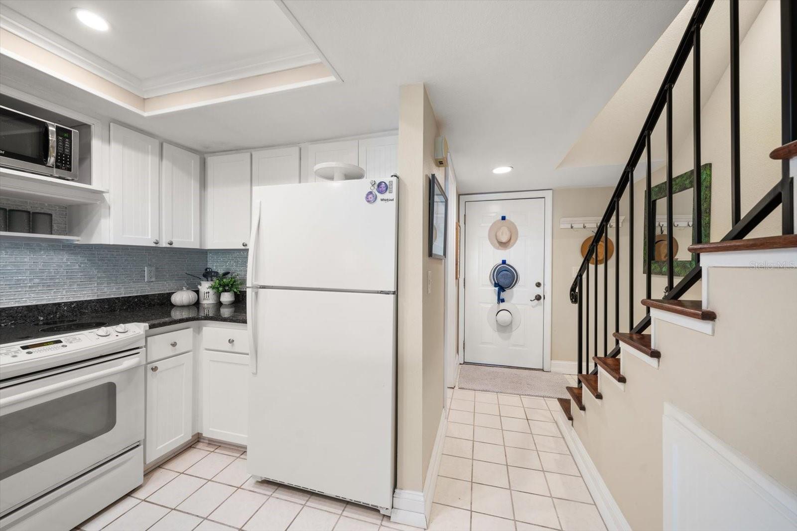 Tasteful finishes include newer appliances, attractive granite with dimensional backsplash
