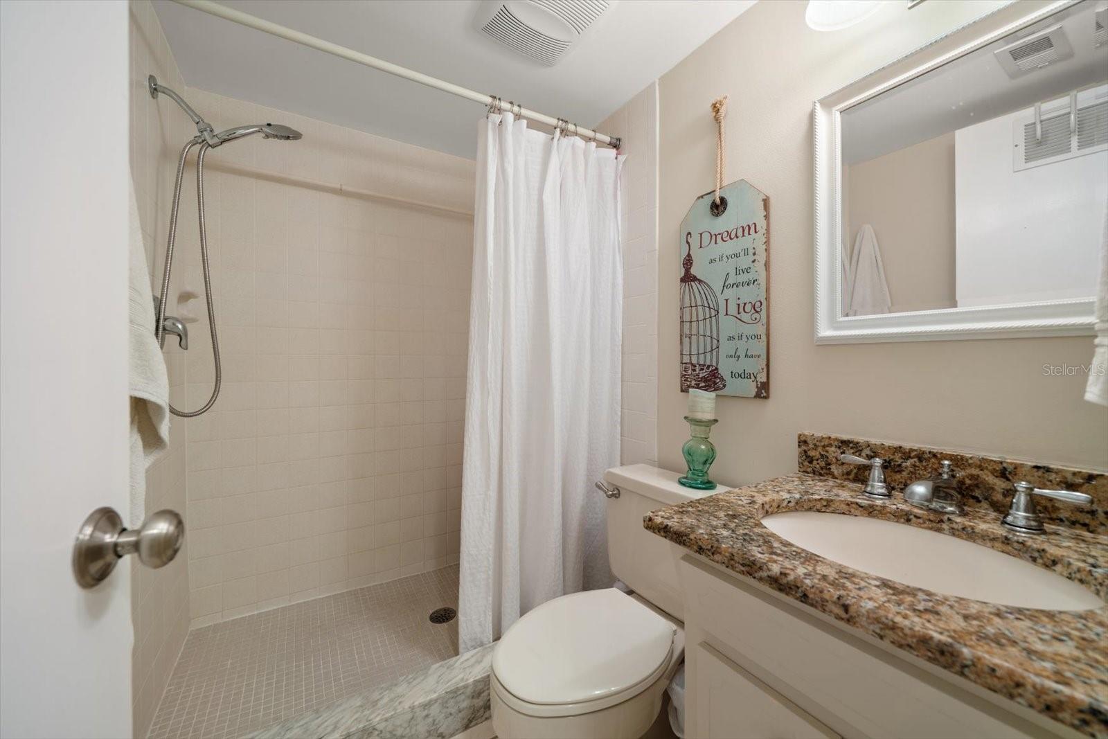 Main living level full bath with walk in shower.