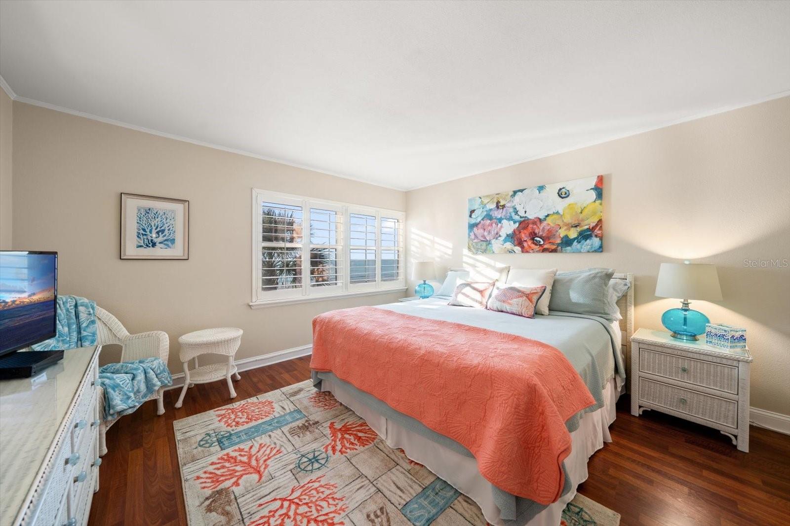 Primary suite has walk in closet and access to bath area.