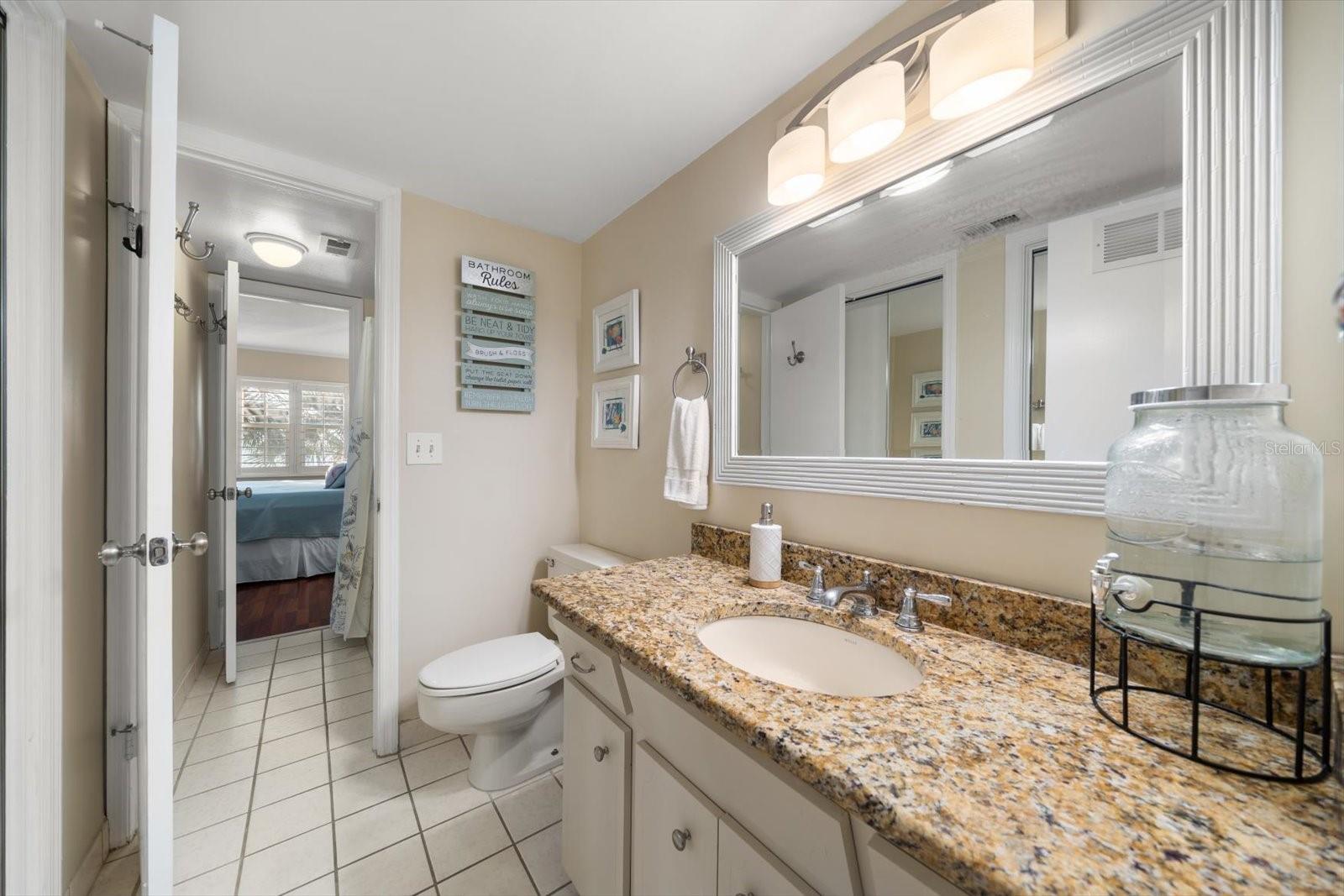 Primary bathroom services both bedroom on the top level.