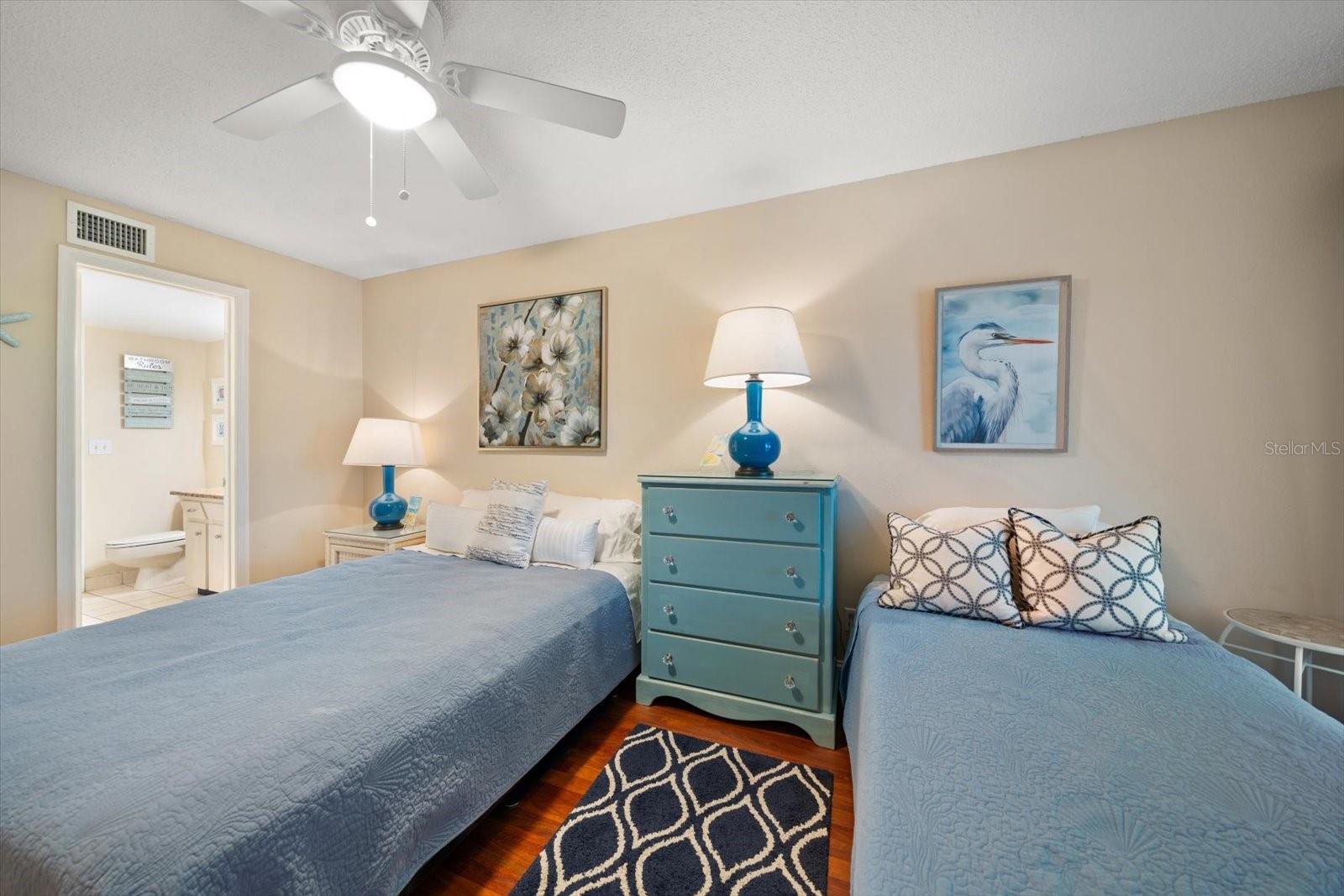 Second bedroom with double and single beds.