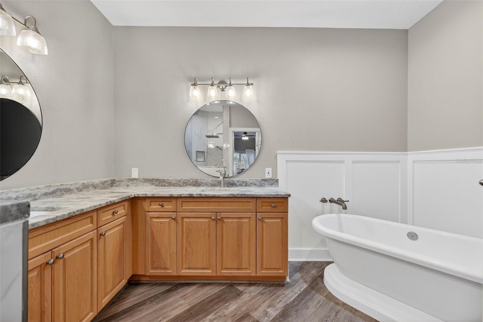 The Primary bath has dual sinks, soaking tub and more