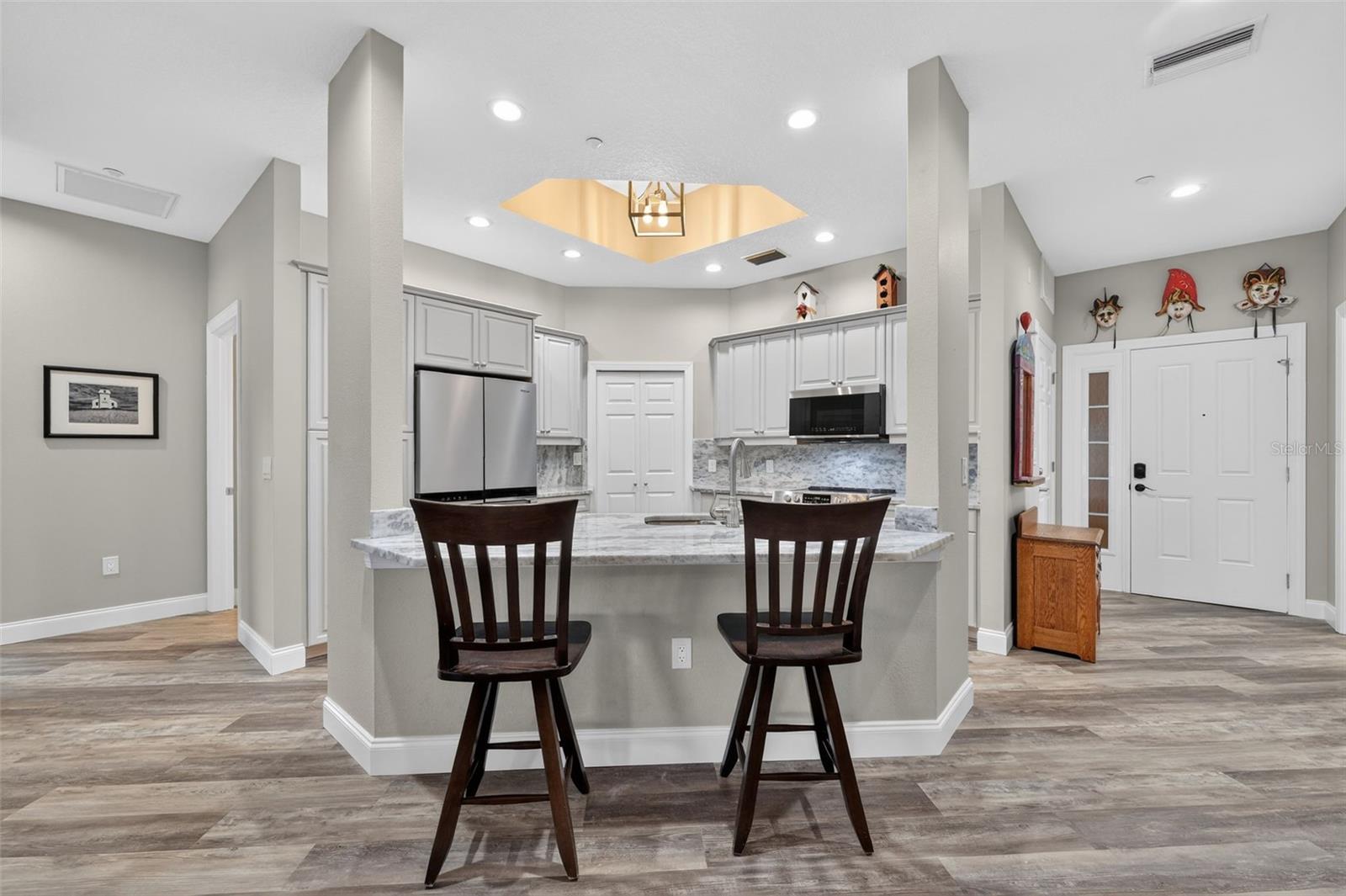 Whn you enter the home you are greated by a large kitchen opening to the dining area and Living Space