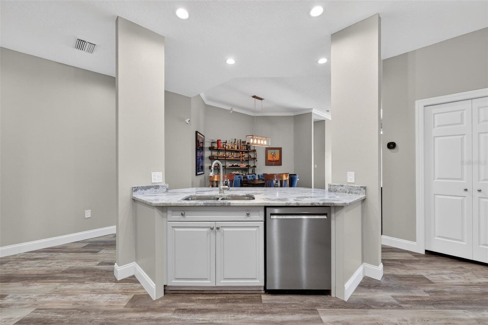 The kitchen is open to the dining area