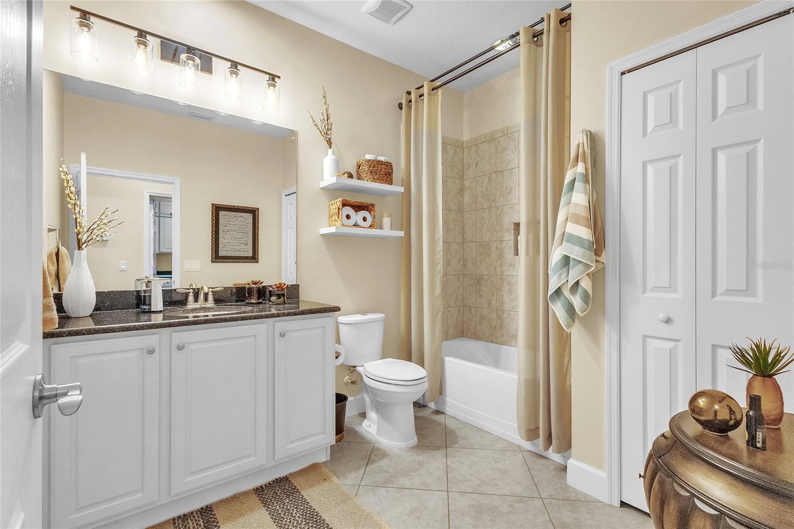 Graciously large: 2nd full bath features granite counter tops, comfort height toilet, tiled shower/tub combo and linen closet and new lighting.