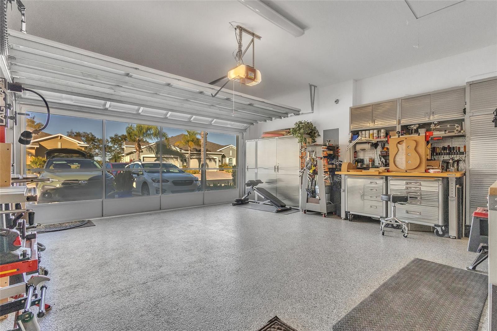Epoxied flooring and a privacy screened garage door. 2/26 New water heater and expansion tank. Added storage in ceiling with plywood flooring.