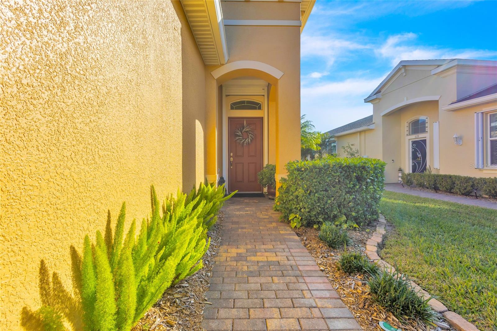 Exterior was freshly painted in 2023. Covered front entry area and electronically controlled hurricane shutters on all windows.