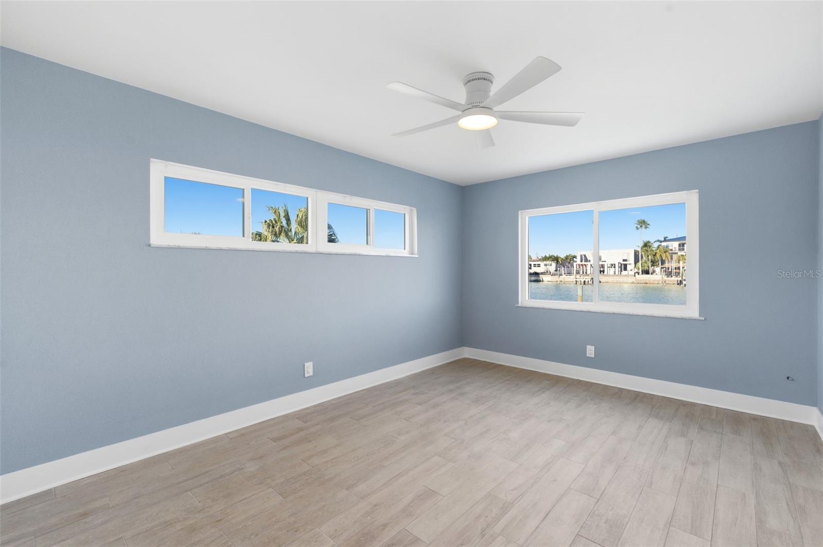 Bedroom #2 with a view of the canal land the pool
