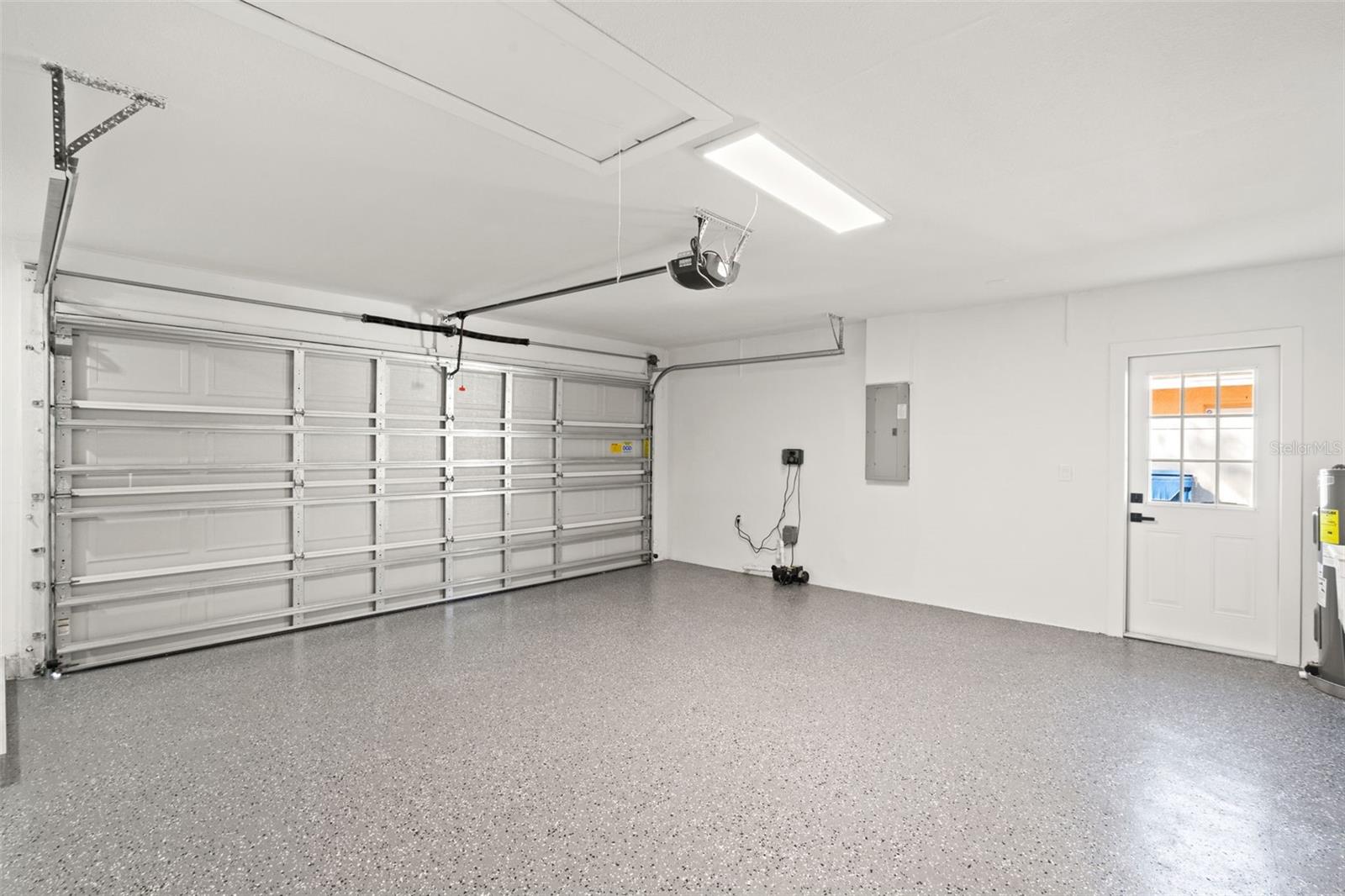 epoxied 2 car garage with walkout and sink