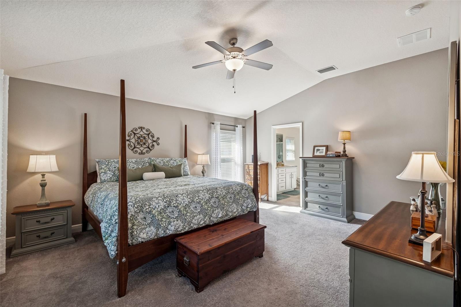 Owner's Suite with vaulted ceilings.  Ceiling Fan