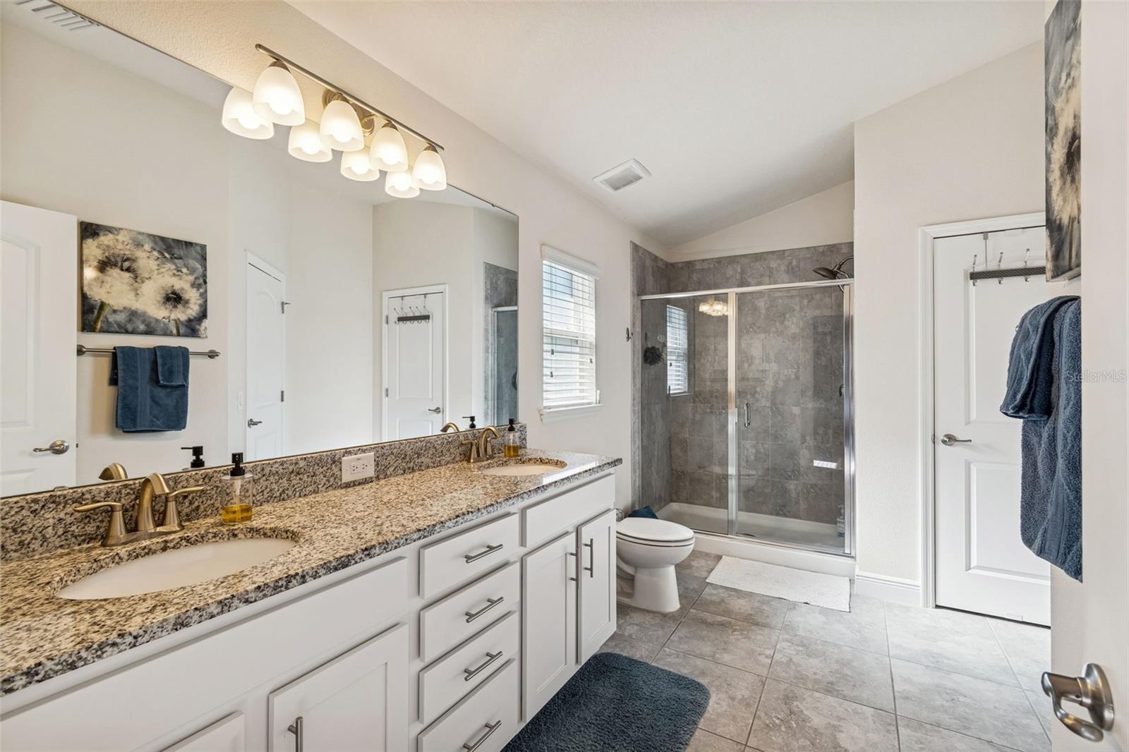 Owner's Bath with Granite countertops, extended shower, Storage Closet, Dual Sinks