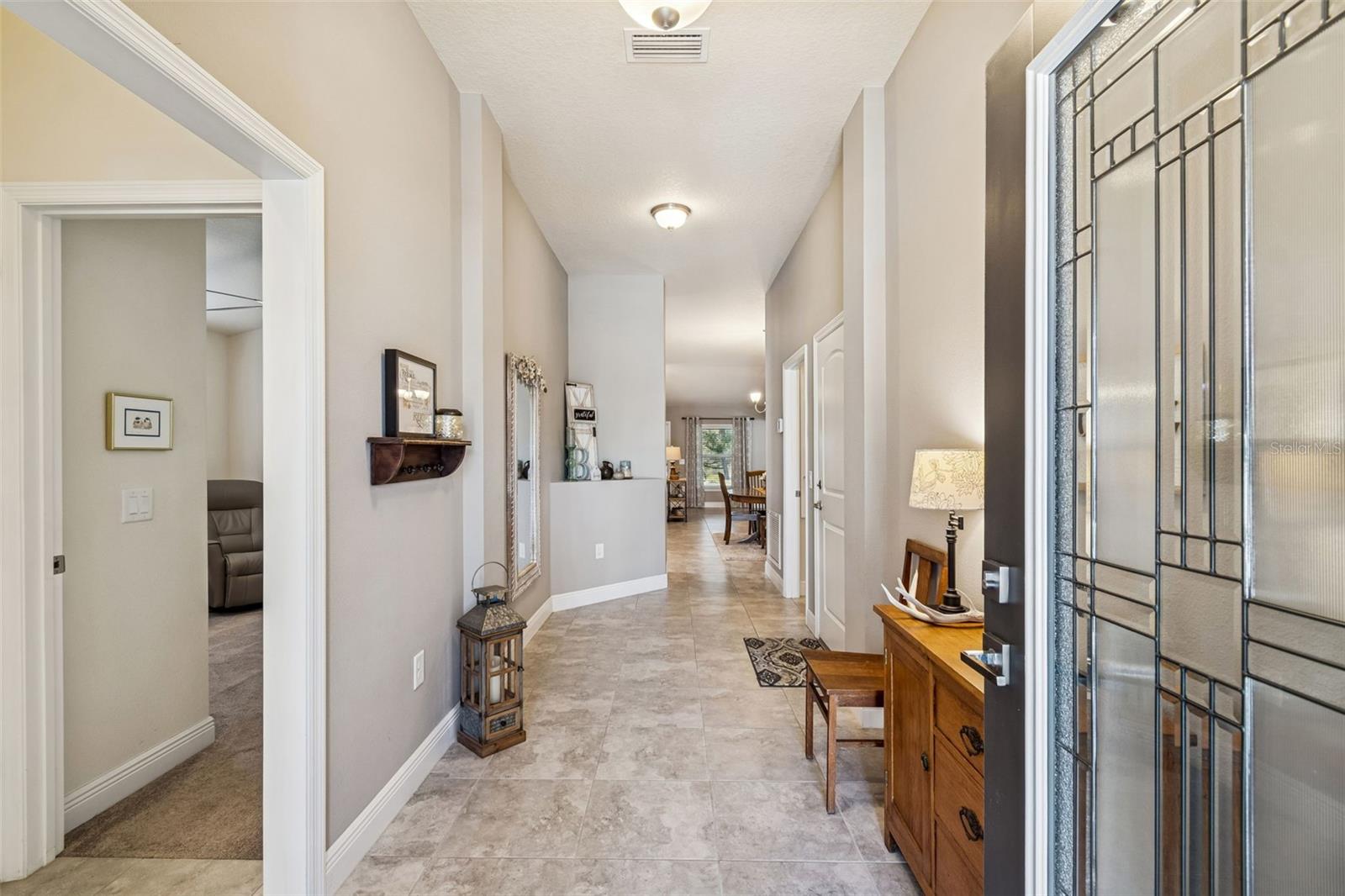 Entry from the front door.  To the left leads to Bedrooms 2 and 3 and Bathroom2.  This is split from the rest of the home.