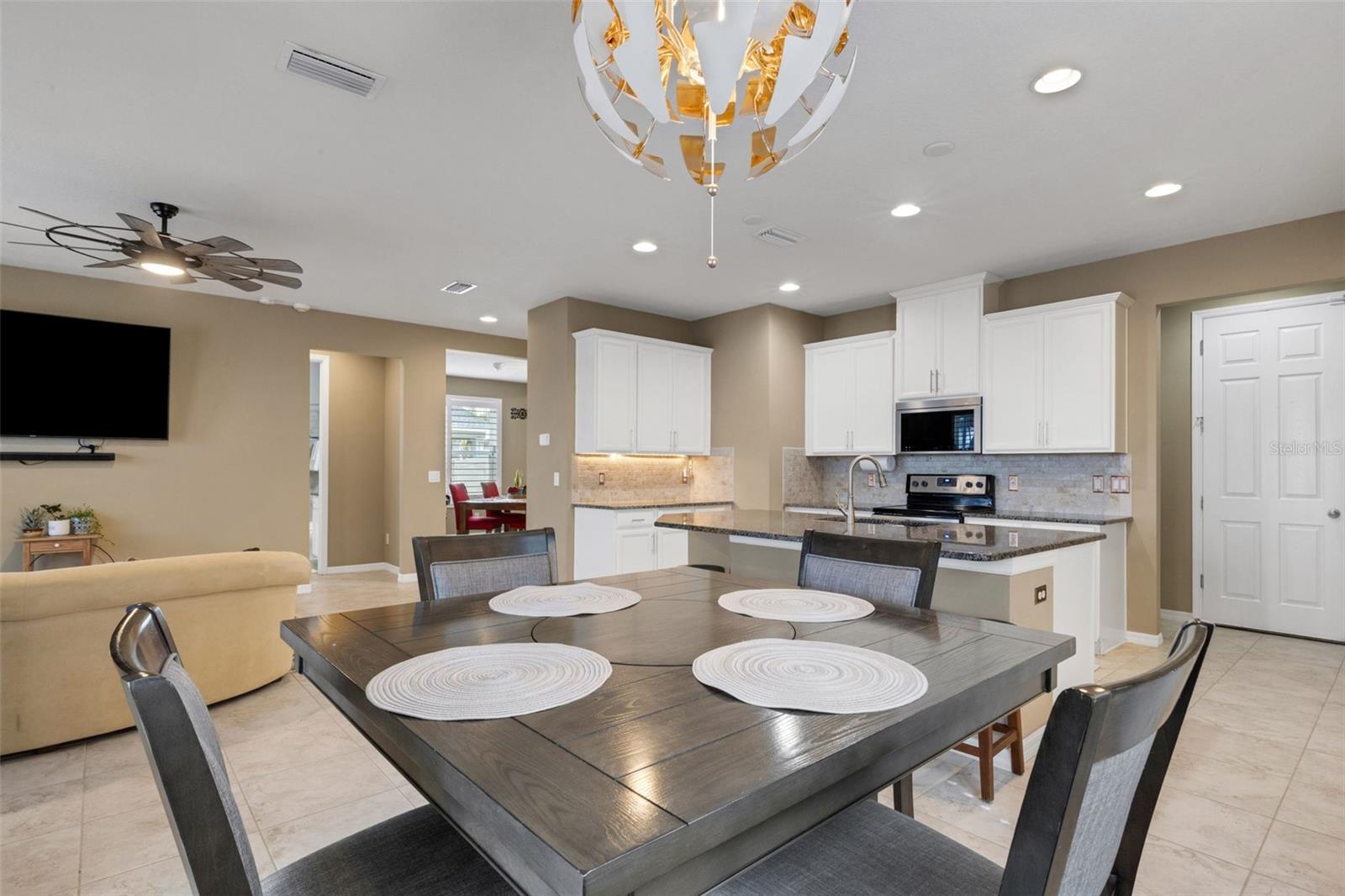 Dining with a view of back yard oasis and pond.