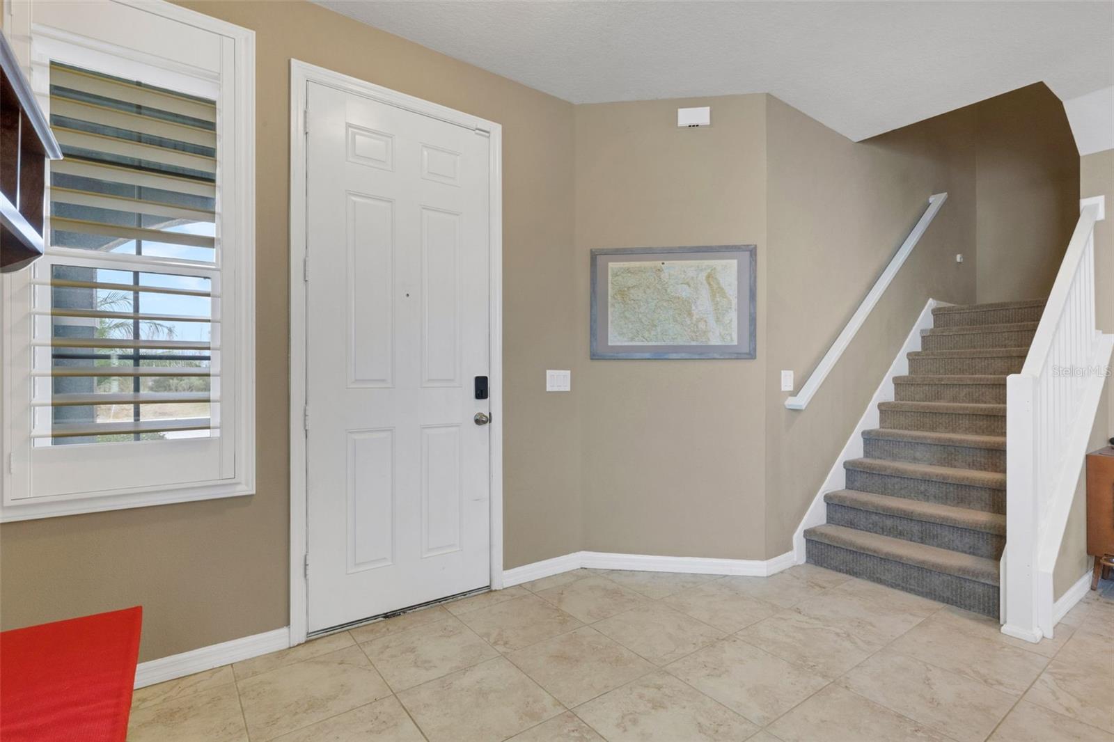 Stairway to upstairs bonus living space and 4 bedrooms / office(s).