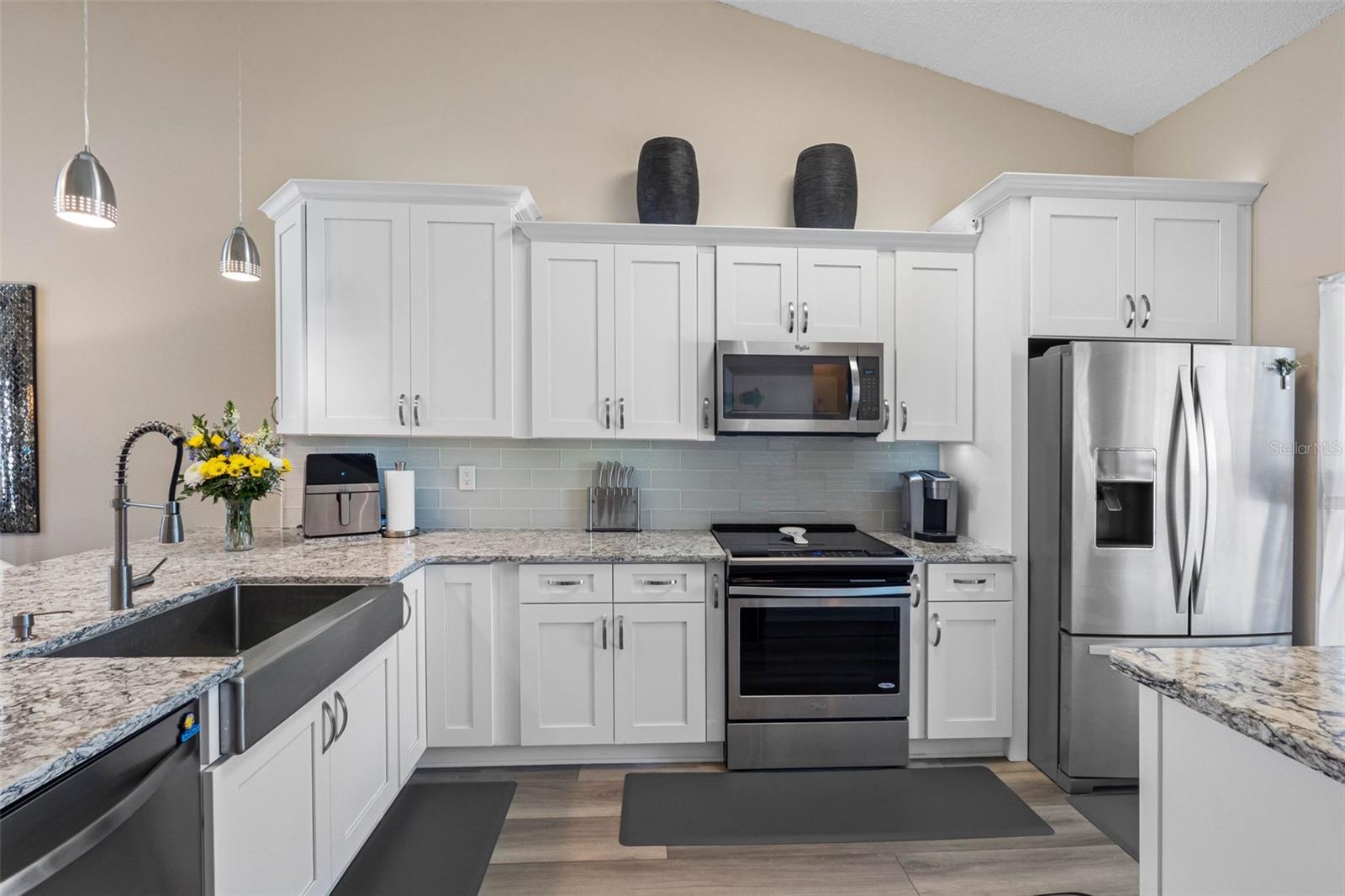 New appliances and large stainless farm sink.