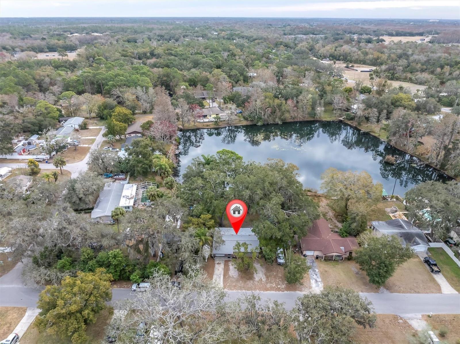 A Secluded home surrounded by a beautiful mature tree canopy on Echo Lake..