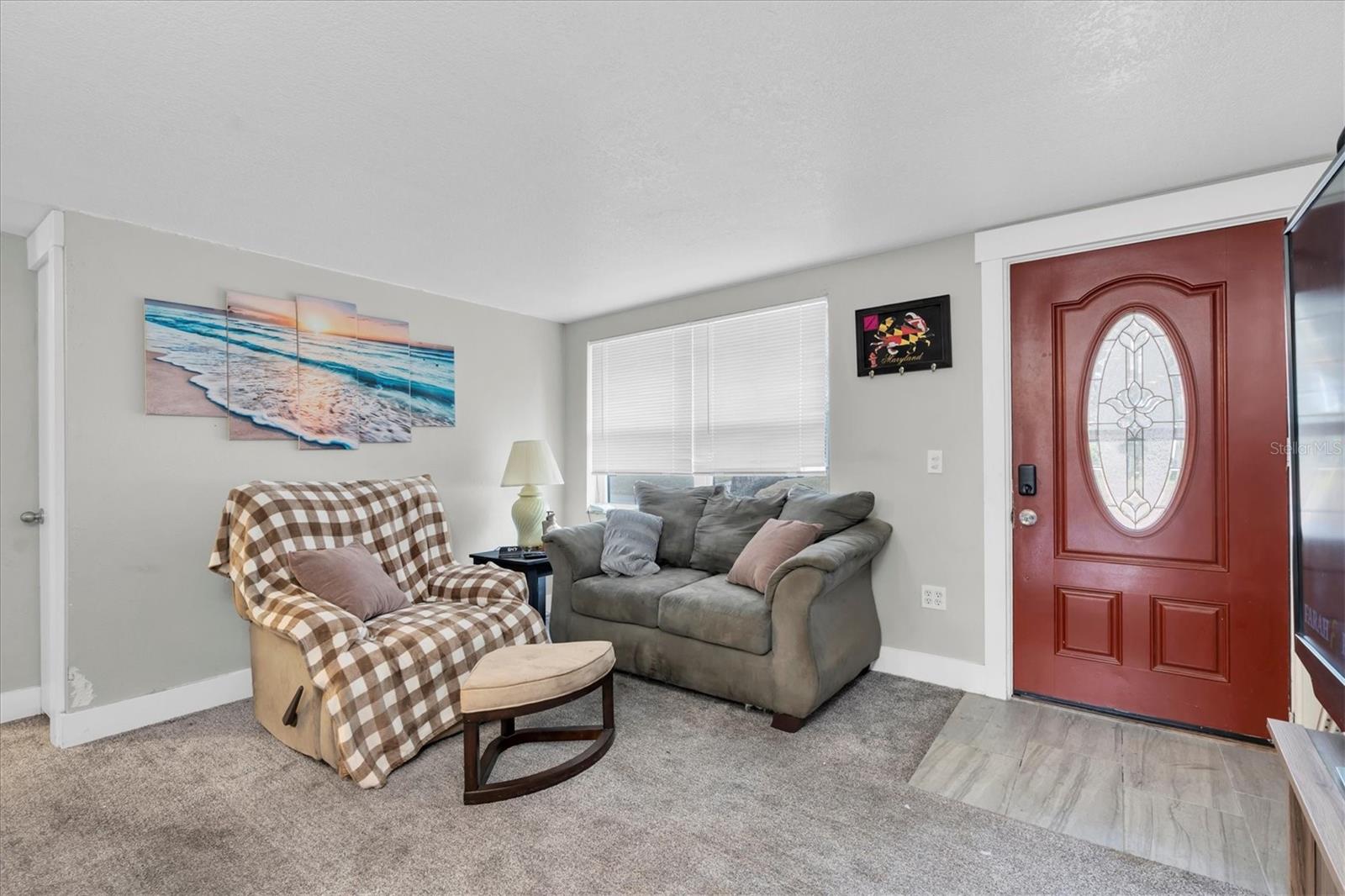 Living room which flows into the Kitchen.