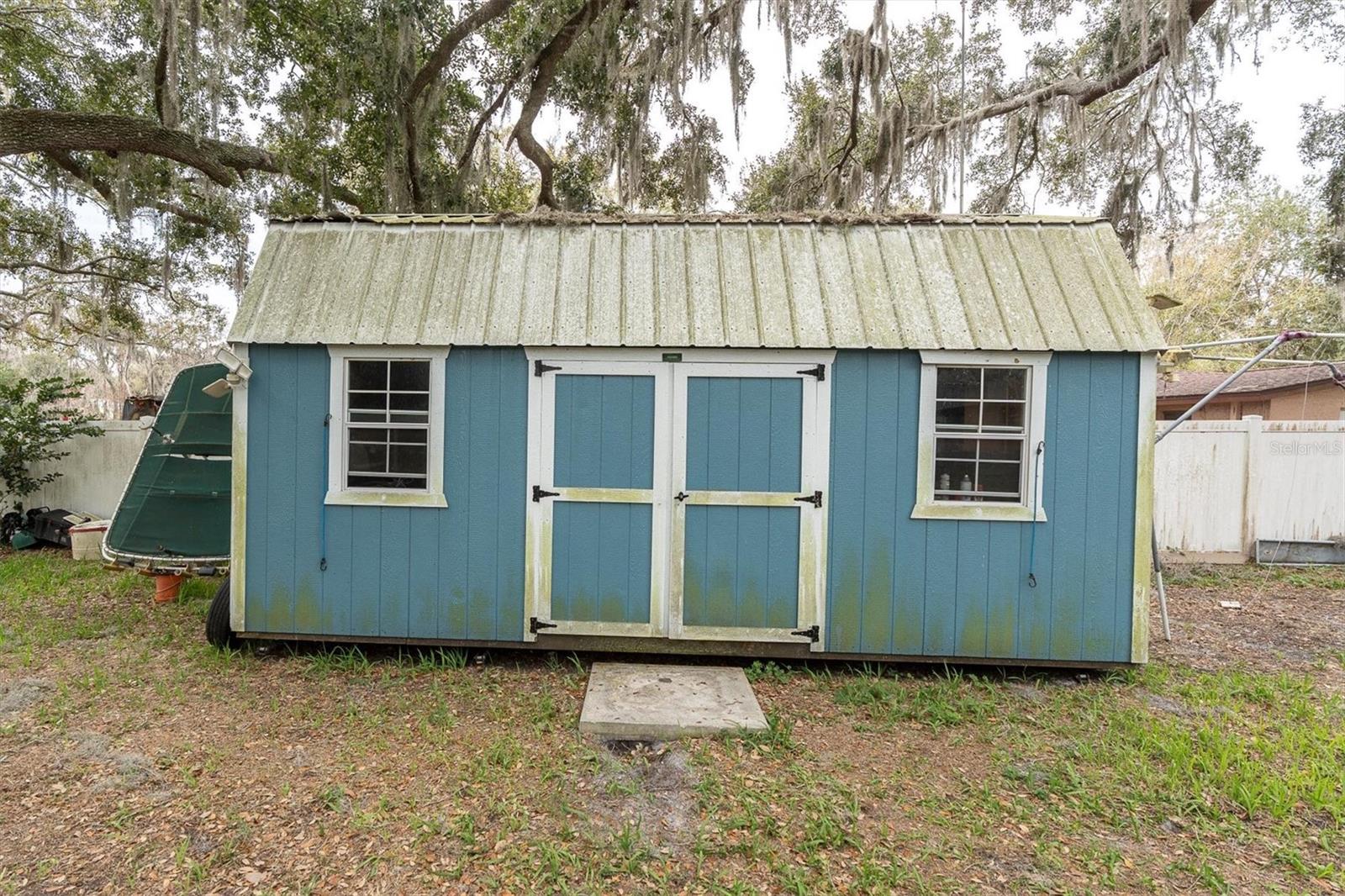 Large Storage unit located in the back yard.  (20x11) There is No electric to this shed.