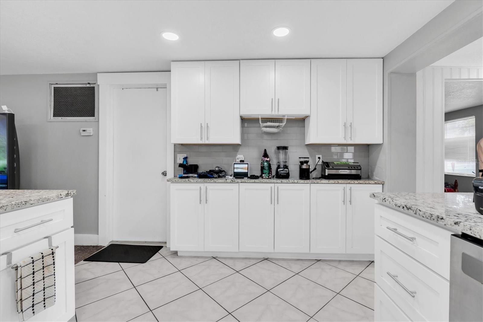 Plenty of extra storage & countertop area along this wall. Livingroom is to the left and dining room / Florida room to the right.